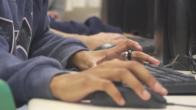 Girl With Silver Ring Typing And Using Mouse On Computer - Close Up 