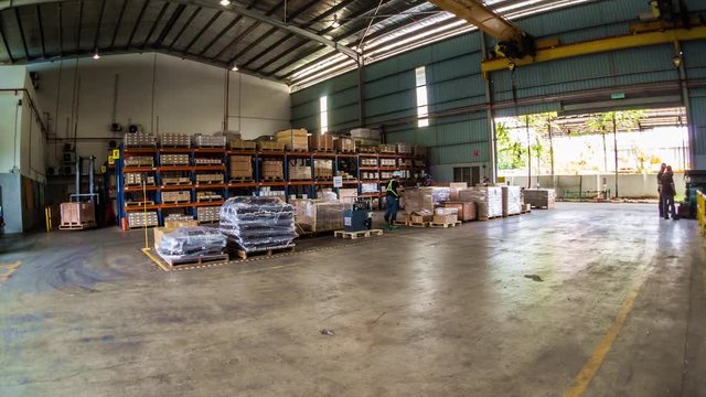 People Working With Lifter In Warehouse Storage - Timelapse 