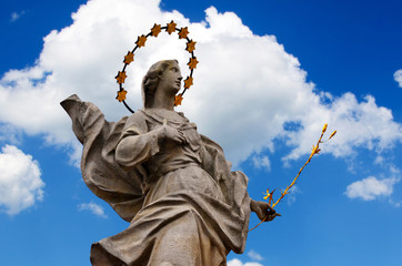 Saint statue with blue sky in a sunny summer day