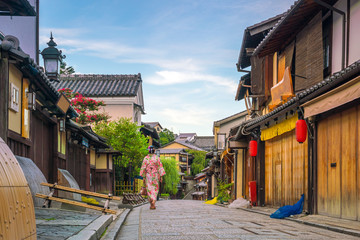 Japanese girl in Yukata with red umbrella in old town  Kyoto