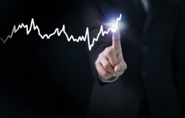 hand with stock financial chart symbols coming from hand