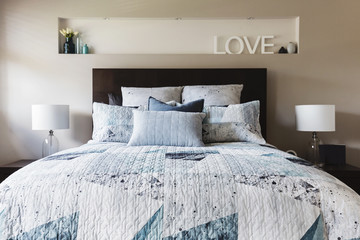 Master bedroom with contemporary quilt duvet and pillows
