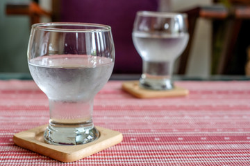 Glasses of water on table.