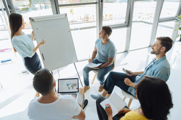 Positive smart businesswoman conducting a lecture
