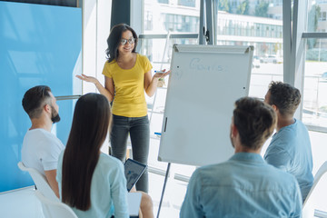 Delighted positive woman conducting a seminar