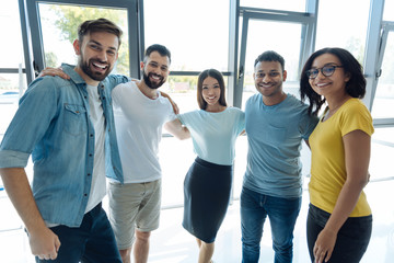 Fototapeta premium Happy young people looking at you