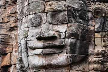 Prasat Bayon with smiling stone faces is the central temple of Angkor Thom Complex, Siem Reap, Cambodia. Ancient Khmer architecture and famous Cambodian landmark, World Heritage.