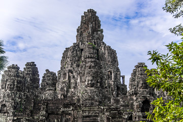 Fototapeta na wymiar Prasat Bayon with smiling stone faces is the central temple of Angkor Thom Complex, Siem Reap, Cambodia. Ancient Khmer architecture and famous Cambodian landmark, World Heritage.