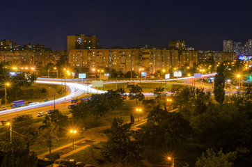 Fototapeta na wymiar night city and traffic lights of urban Kiev, Ukraine