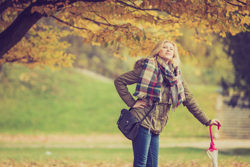 Woman walking in park during autumn