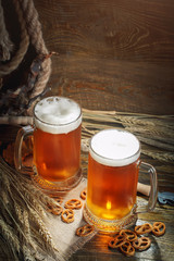 Glasses of fresh beer on a wooden table.