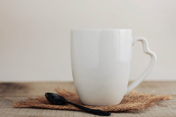 cup and spoon with white background.