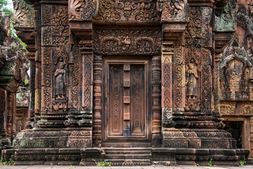 Fototapeta na wymiar Banteay Srei is built largely of red sandstone and is a 10th-century Cambodian temple dedicated to the Hindu god Shiva, Siem Reap, Cambodia