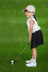 Asian Chinese little girl playing golf