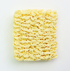 Raw egg noodles on white background.