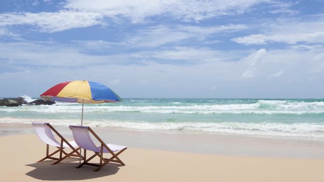 White beach chairs and umbrellas on Katanoi Beach, Phuket, Thailand