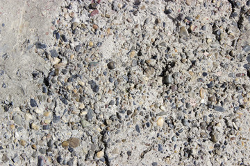 rough gray background wall with protruding portions of porous