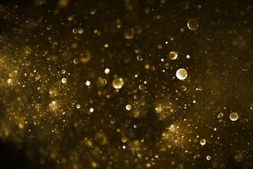 Abstract colorful blurred golden drops and sparkles on black background. Fantasy fractal texture. Digital art. 3D rendering.