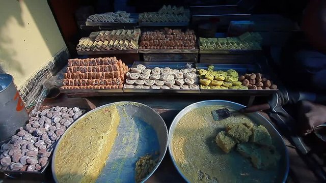 Sale of traditional Indian sweets on the street