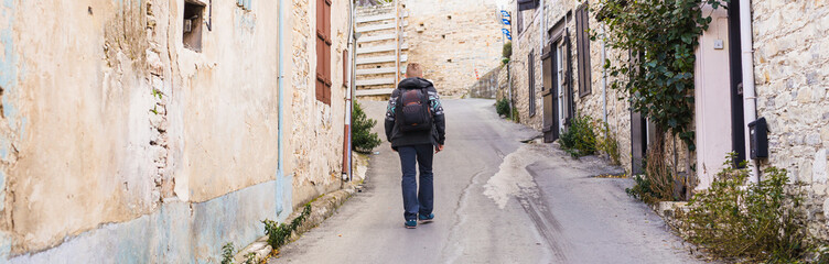 Fototapeta na wymiar Hiker walks alone. Travel and adventures concept.