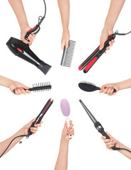 hands holding hairdressing tools