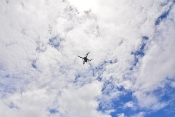 Drone camera flying for take a picture on blue sky background