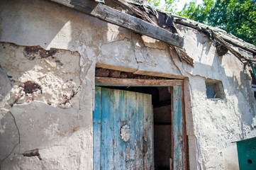 Ruined house in the war. House without a roof. War. Avdeevka, Donbass, Donetsk region, Ukraine. Shells and bullets rusty