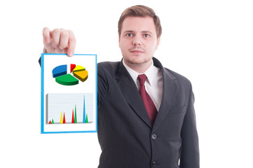 Young businessman holding paper with investment growth