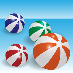 Vector illustration of colorful beach balls on a blue background