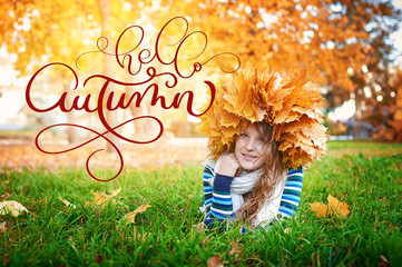 Hello Autumn calligraphy lettering text on Young beautiful girl in autumn park