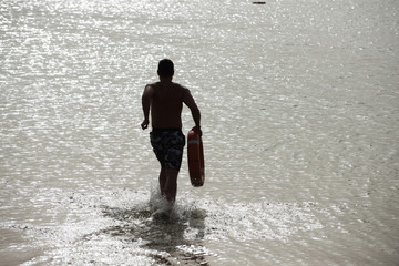Man back silhouette with red life ring