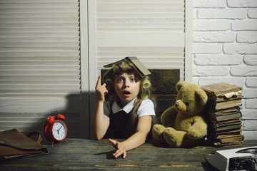 child with bear and alarm clock