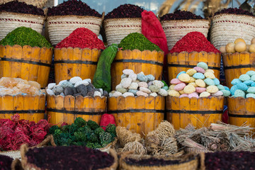 Multicolored pumice stones dry algae in wooden buckets