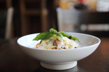 Chorizo sausage spaghetti fettuccine on wood background