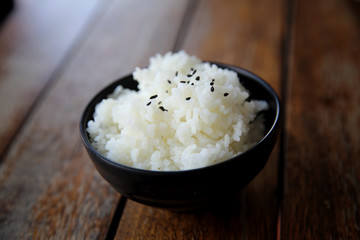 Rice on wood background