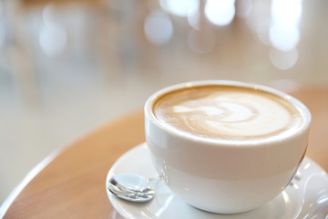 cappuccino coffee on wood background