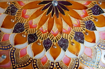 Photo of hand painted lamp in mandala geometric style, imitation stained glass
