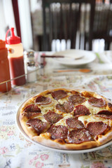 Pepperoni pizza , pizza with pepperoni mozzarella cheese and tomatoes with sauce background italian food