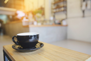 Black coffee on wood background in coffee shop