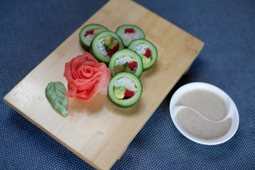 Fototapeta na wymiar Sushi with cucumber and salmon