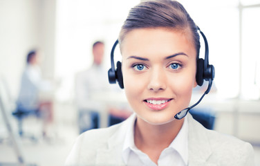 helpline operator with headphones in call centre