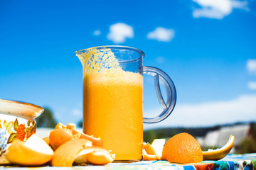 Squeezed orange juice and fresh oranges fruits