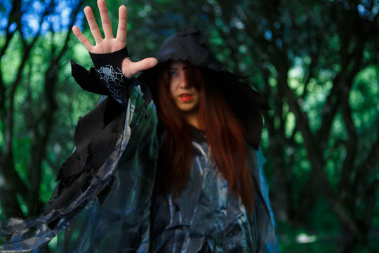 Image of witch in cloak