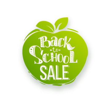Back to school sale. Hand lettering inscribed in the apple shape paper with shadow. Vector illustration.