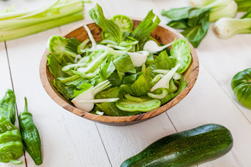 vegetable green salad bowl on kitchen table, balanced diet