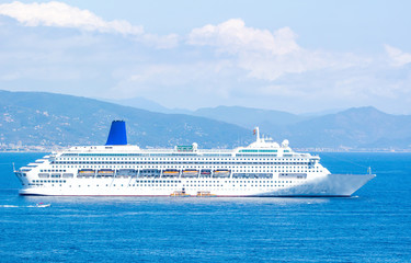 Big cruise ship in the blue sea in summer. Beautiful seascape.