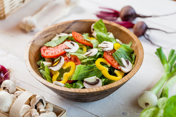 vegetable salad bowl on kitchen table, balanced diet
