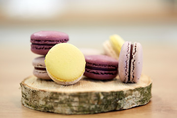 different macarons on wooden stand