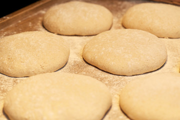 Fototapeta na wymiar yeast bread dough on bakery kitchen table