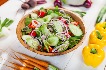 vegetable salad bowl on kitchen table, balanced diet